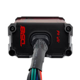 Cable end of a DS18 MP.4A amplifier with a black end plate and sleeved multicolored wire bundle