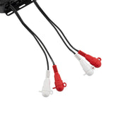 Close-up of four red and white capped RCA connectors on amplifier leads