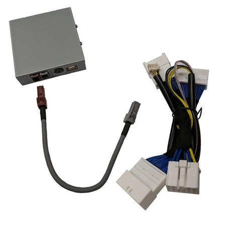 Silver VAIS interface module with a white wiring connector, multicolored harness and short gray cable