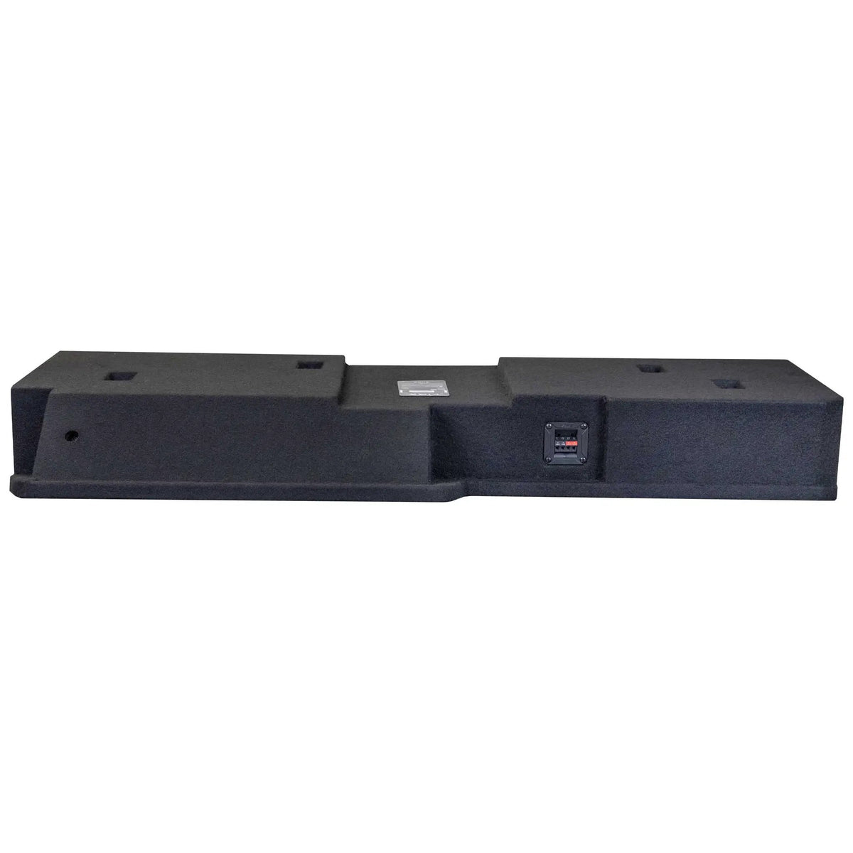 Low rear angle of a long carpeted enclosure with a stepped center section and terminal cup