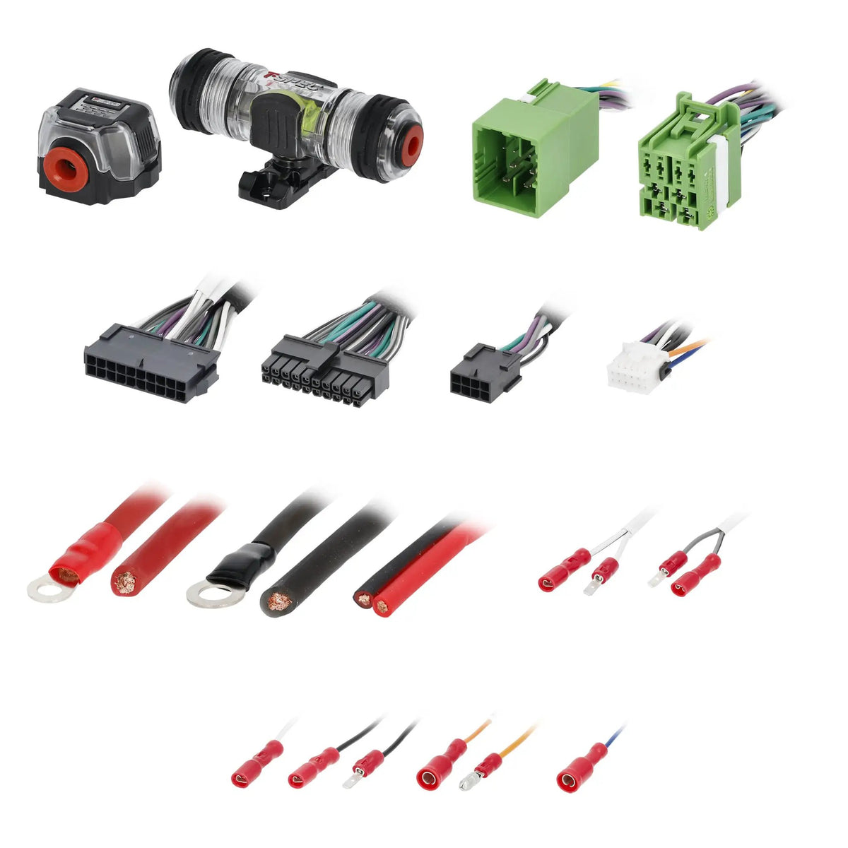 Fuse holders, green harness connectors, power leads and assorted crimp terminals laid out on white