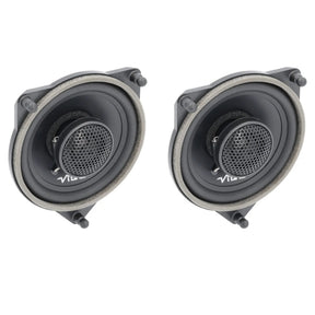 Angled pair of VIBE coaxial speakers with mesh-covered center tweeters and foam-edged triangular frames