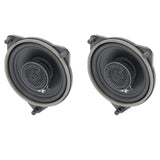 Angled front view of two VIBE coaxial speakers with mesh-covered tweeters