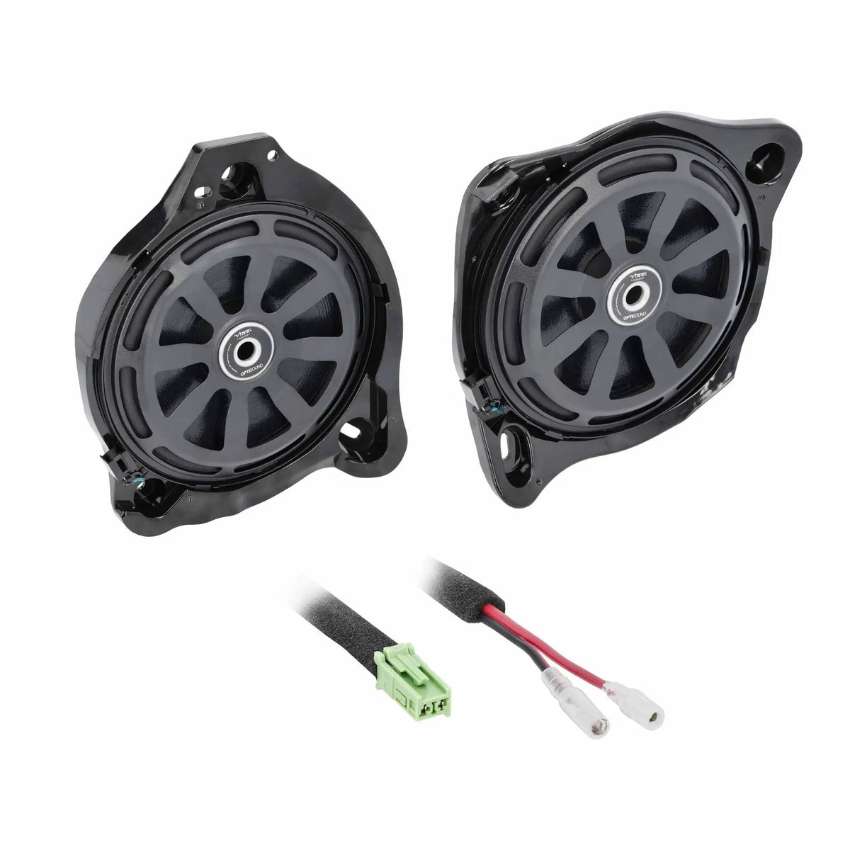 Two shallow speakers with protective grilles and green-plug wiring adapters