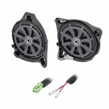 Angled view of two shallow speaker assemblies with green connector and terminal leads