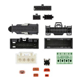 Close-up views of assorted wiring connector faces and colored fuses